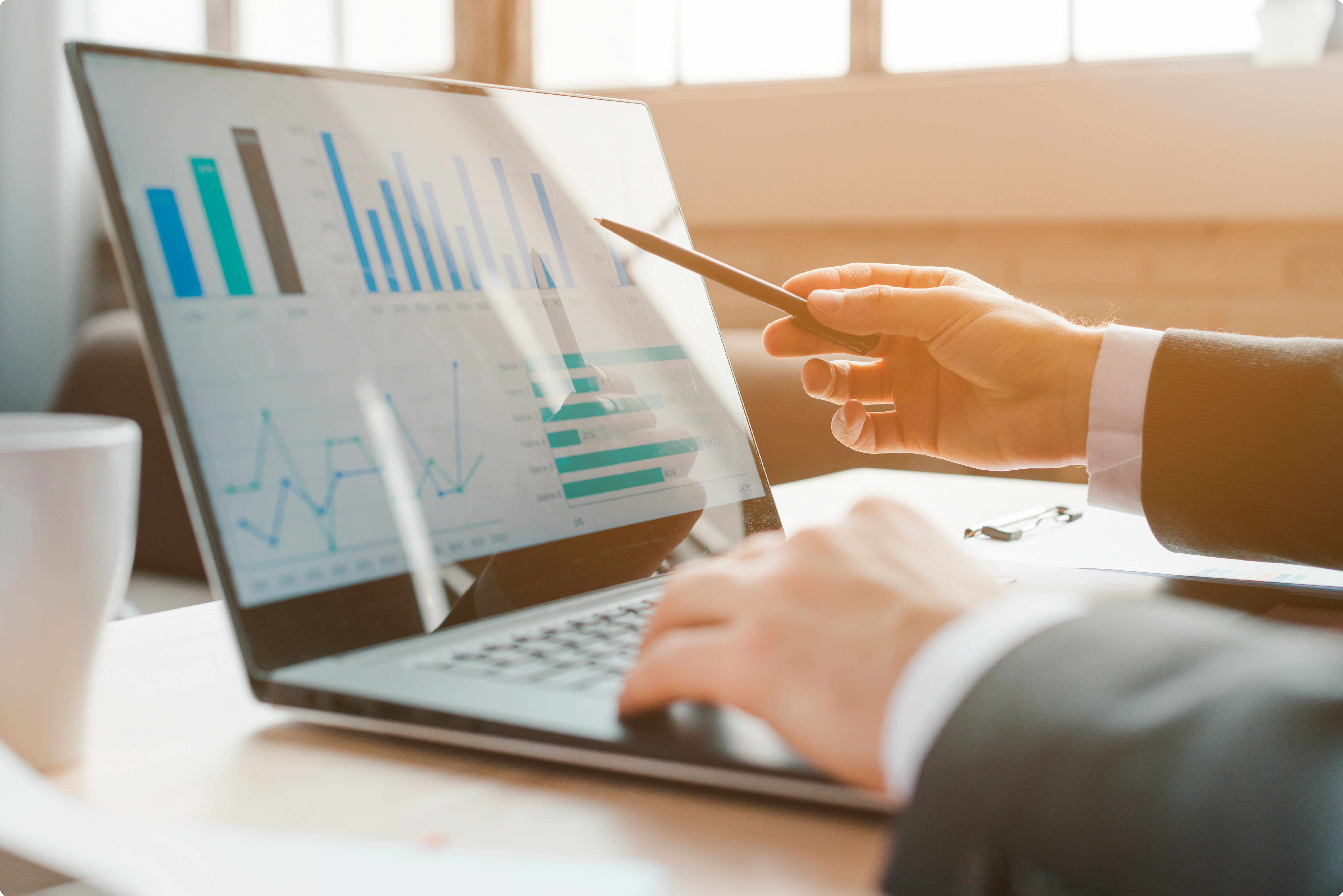 Reviewing sales pipeline analytics on a laptop